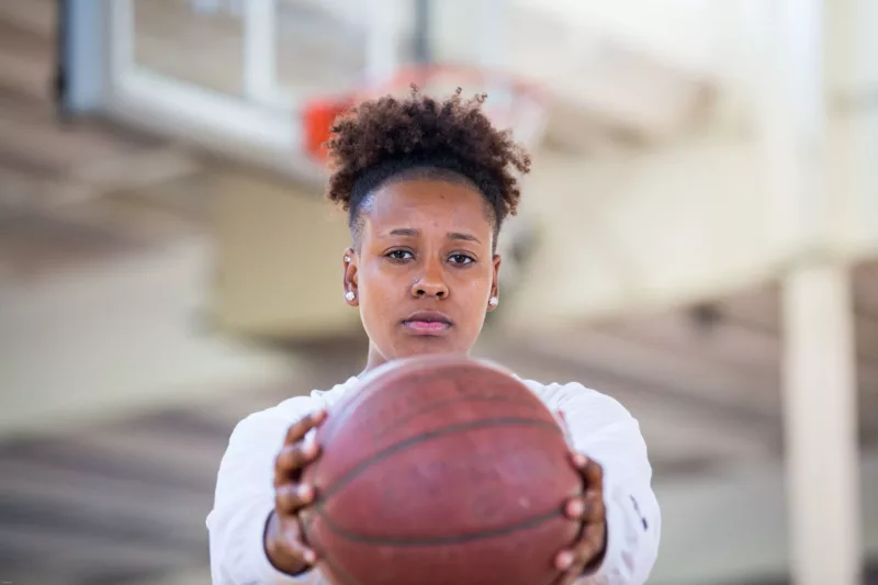 YFC_Teen_holding_basketball